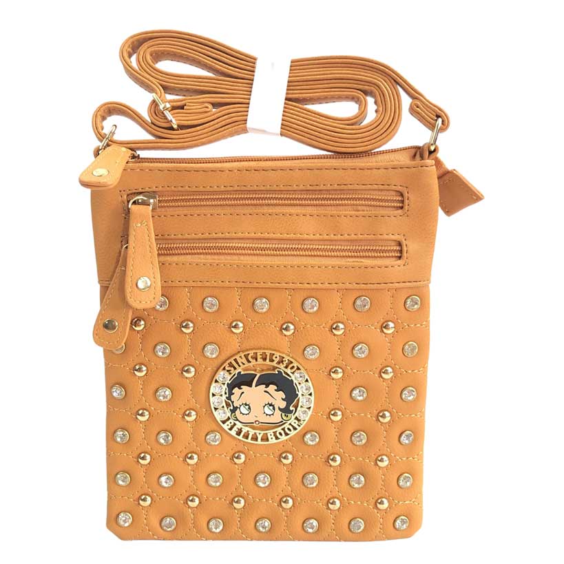 Mensajera Betty Boop de color mostaza, placa circular con imagen de Betty Boop en el centro, piedras decorativas de color dorado y piedras en cristal cortado y pulidas decorativas, dos primeros cierres de color mostaza oscuro y detalles dorados en la parte de enfrente, y un cierre principal en color mostaza oscuro y detalles dorados en la parte superior, asa ajustable del material cuero ecológico, el mismo del resto de la mensajera.
