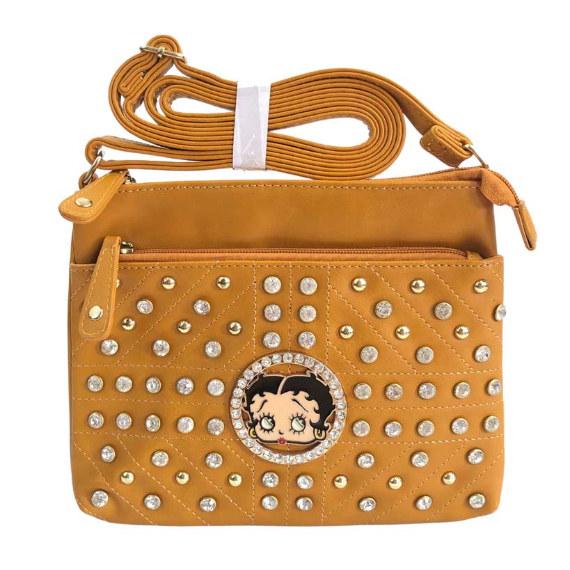 Mensajera Betty Boop de color mostaza, placa circular con imagen de Betty Boop en el centro, piedras decorativas de color dorado y piedras en cristal cortado y pulidas decorativas, Primer cierre de color mostaza oscuro y detalles dorados en la parte de enfrente, y un cierre principal en color mostaza oscuro y detalles dorados en la parte superior, asa ajustable del material cuero ecológico, el mismo del resto de la mensajera.