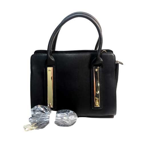 Bolso para dama HNA en color negro, material piel vegana, viene con detalles en metal de color dorado en el frente del bolso, cuenta con asa ajustable del color del bolso para usar en manos libres, asa estática en la parte superior del color del bolso para usar con la mano.